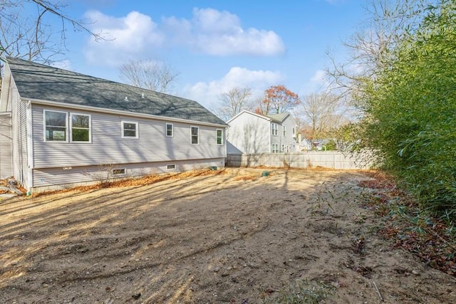 view of property exterior featuring fence