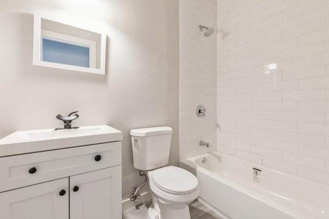 full bathroom featuring vanity, toilet, and tiled shower / bath combo