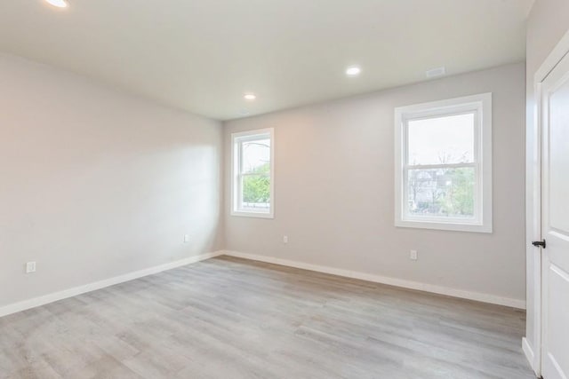 empty room with light wood-type flooring