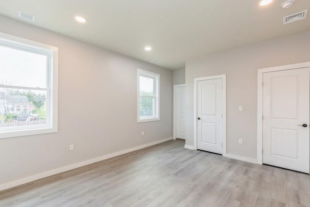 unfurnished bedroom featuring light hardwood / wood-style flooring