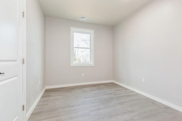 unfurnished room with light hardwood / wood-style flooring