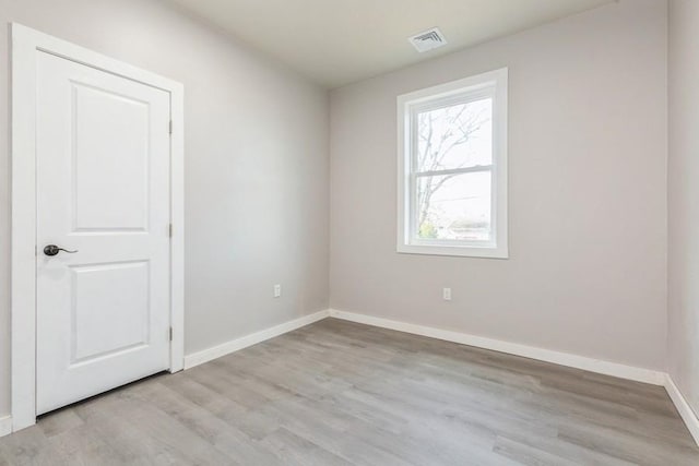 spare room featuring light hardwood / wood-style floors