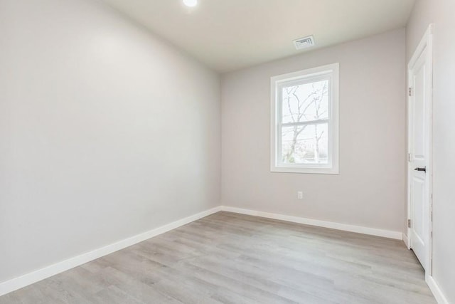 spare room with light wood-type flooring