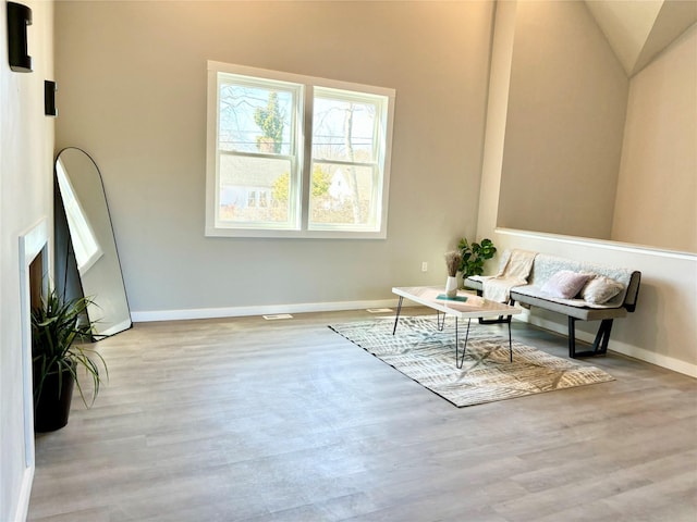 sitting room with wood finished floors and baseboards