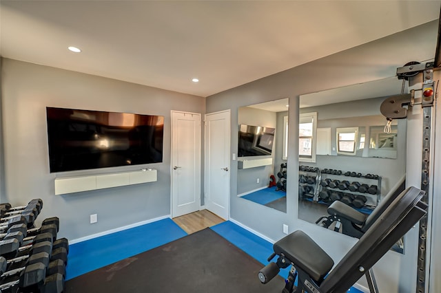 exercise area with hardwood / wood-style flooring