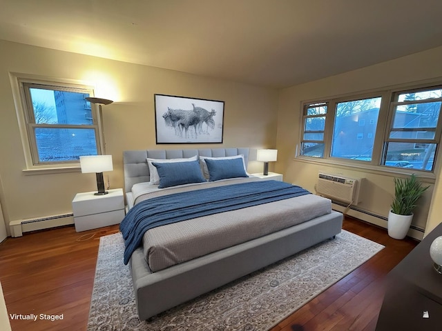 bedroom featuring a wall mounted air conditioner, baseboard heating, and dark wood-type flooring