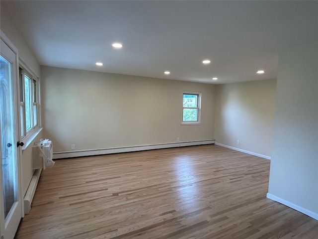 665 Pelham Rd Unit A15, New Rochelle, NY 10805 - empty room with wood finished floors, recessed lighting, a baseboard radiator, and baseboards