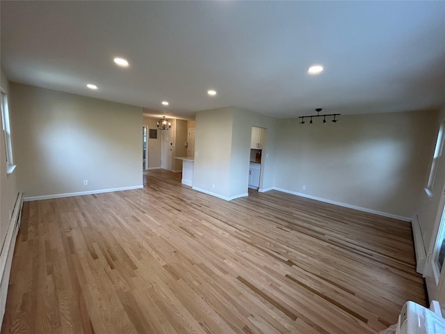 665 Pelham Rd Unit A15, New Rochelle, NY 10805 - empty room featuring a chandelier, baseboards, recessed lighting, and light wood-style flooring
