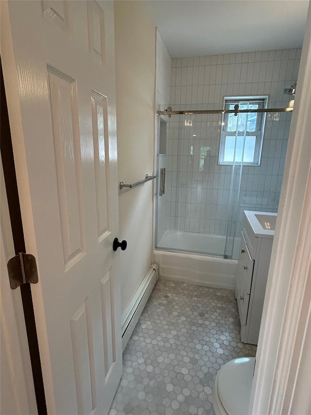 665 Pelham Rd Unit A15, New Rochelle, NY 10805 - bathroom featuring baseboard heating, toilet, enclosed tub / shower combo, vanity, and tile patterned floors