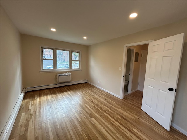 665 Pelham Rd Unit A15, New Rochelle, NY 10805 - empty room featuring a baseboard heating unit, wood finished floors, recessed lighting, and baseboards