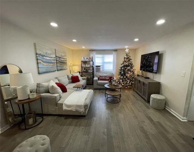 living room with cooling unit and dark wood-type flooring