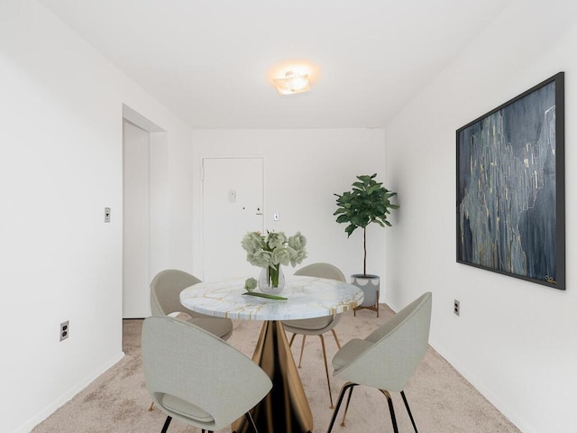 view of carpeted dining space