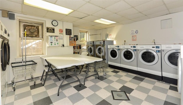 laundry room with washer and dryer and a healthy amount of sunlight