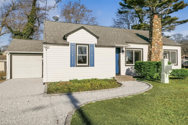 ranch-style home featuring a garage and a front yard