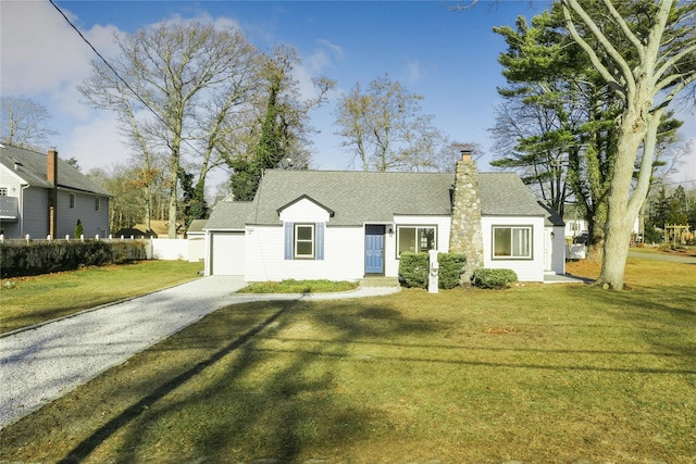 view of front of property featuring a garage and a front yard