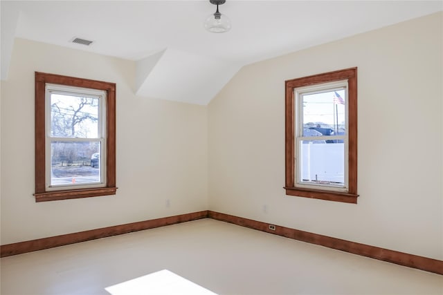 additional living space featuring vaulted ceiling