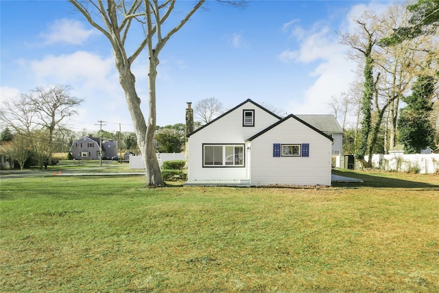 view of side of home featuring a yard