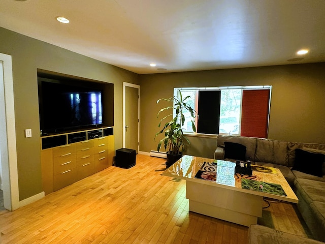 living room featuring baseboard heating and light wood-type flooring