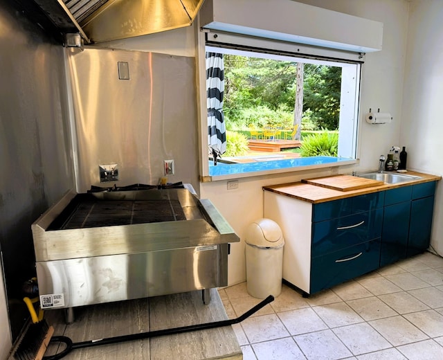 bathroom with tile patterned flooring and sink