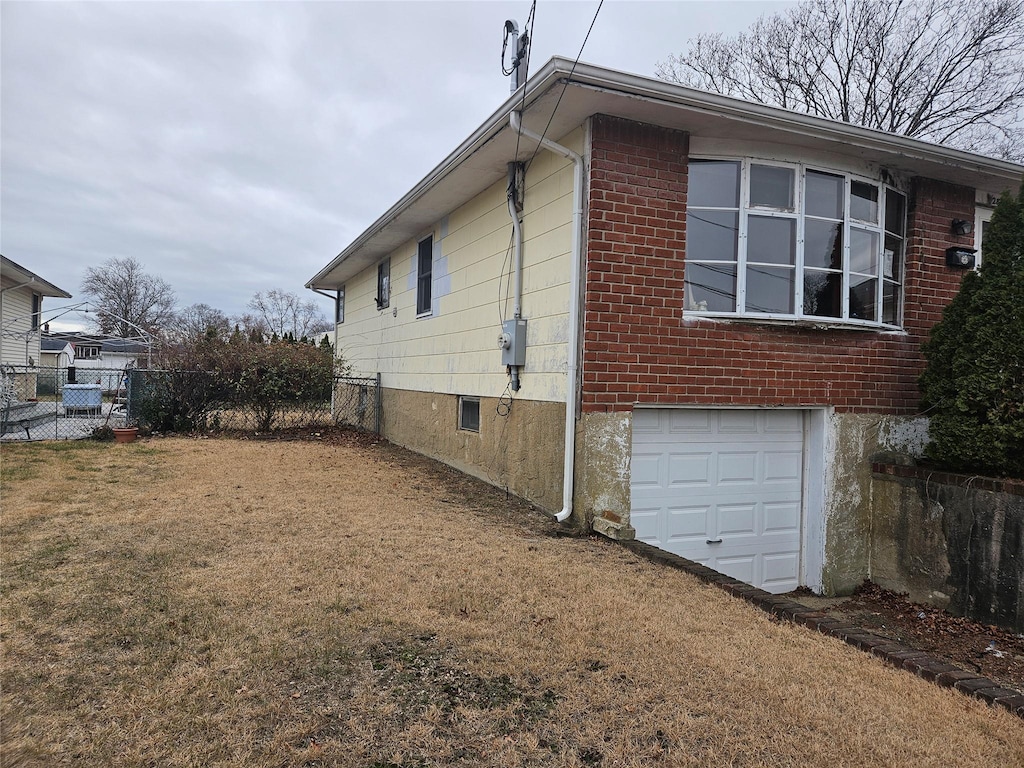 view of side of home with a garage