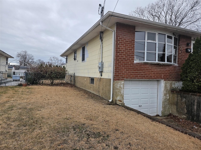 view of side of home with a garage