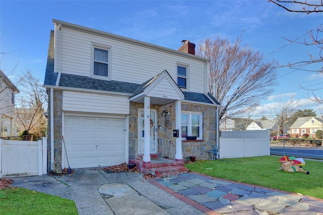 front facade with a garage and a front lawn