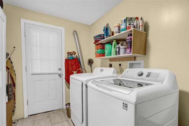 clothes washing area with washer and clothes dryer