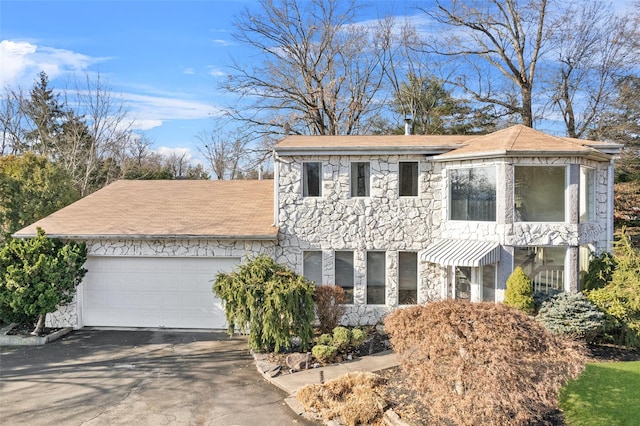 view of front of property with a garage