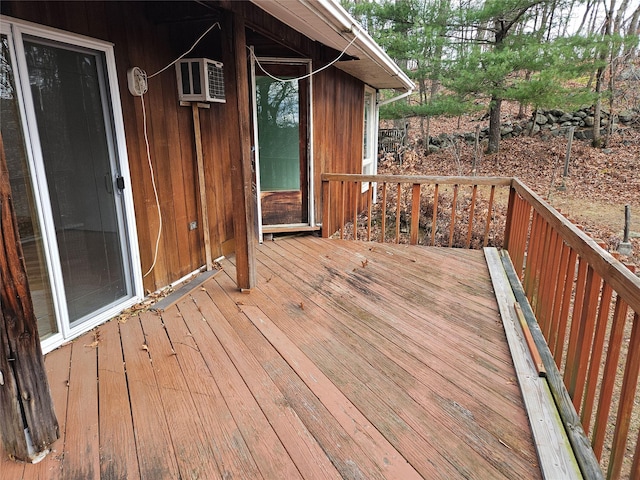 wooden deck with a wall mounted AC