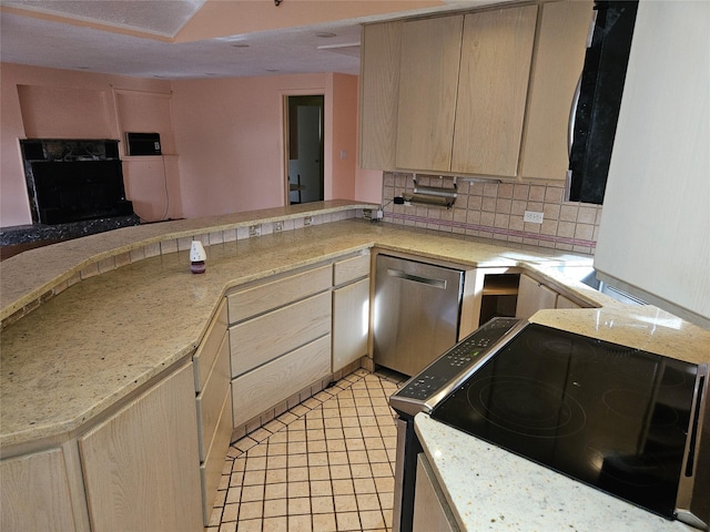 kitchen with kitchen peninsula, black stove, decorative backsplash, light brown cabinetry, and dishwasher