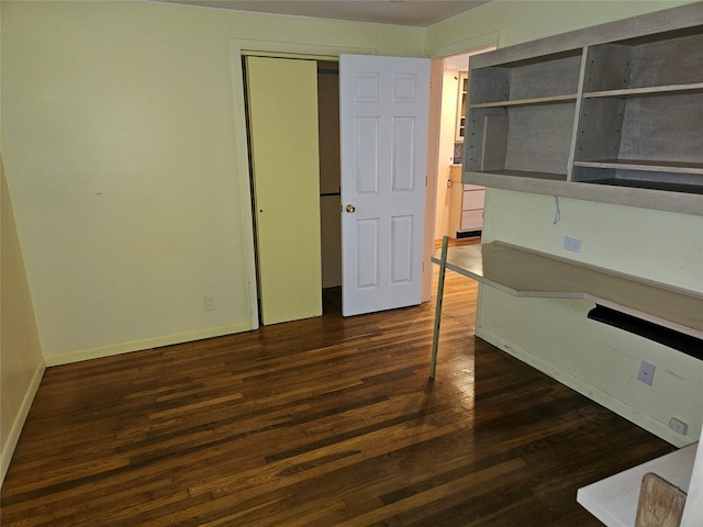 unfurnished room featuring dark hardwood / wood-style floors