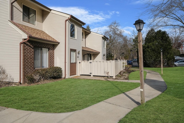 view of home's exterior featuring a yard