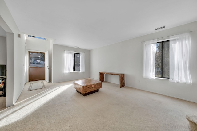 living area with light carpet