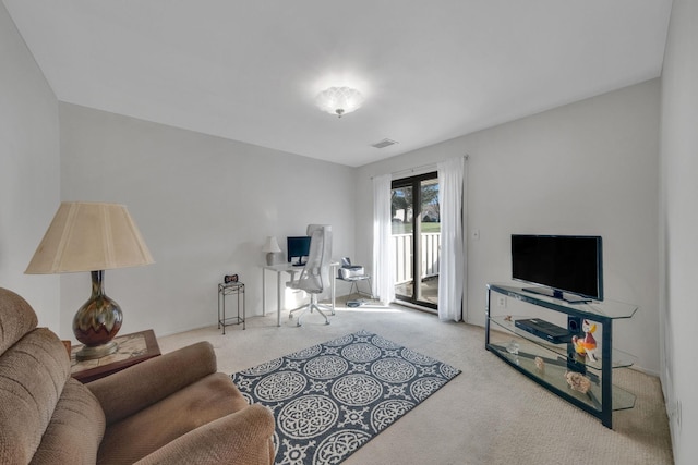 living room featuring light carpet