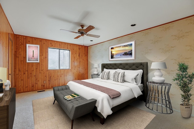 bedroom featuring ceiling fan, carpet floors, wood walls, and ornamental molding