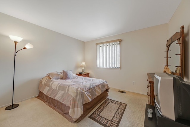 bedroom with light carpet