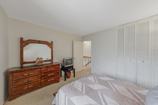 carpeted bedroom featuring a closet