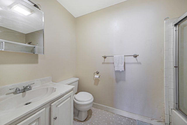 full bathroom featuring tile patterned floors, vanity, toilet, and bath / shower combo with glass door