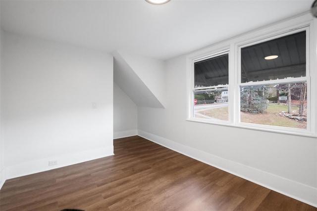 bonus room featuring dark wood-type flooring