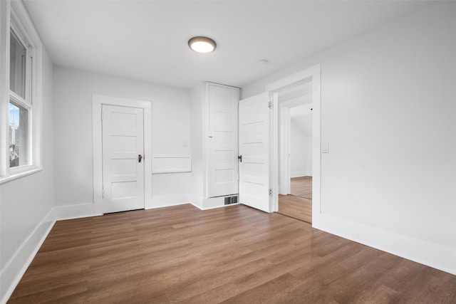 unfurnished bedroom featuring hardwood / wood-style floors