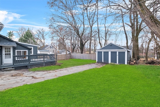 view of yard with a deck and a storage unit