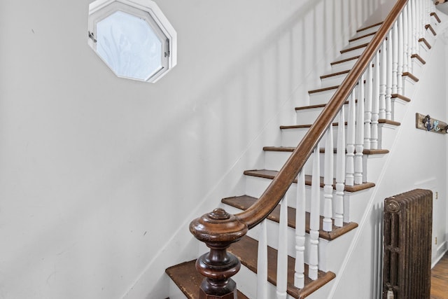 staircase with radiator heating unit