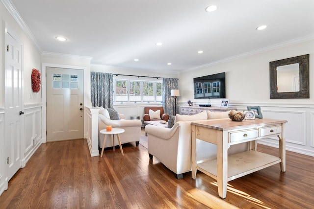 living room featuring a decorative wall, dark wood-style flooring, recessed lighting, and crown molding