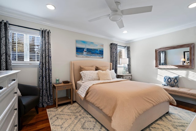 bedroom featuring multiple windows, ornamental molding, dark wood-type flooring, and recessed lighting