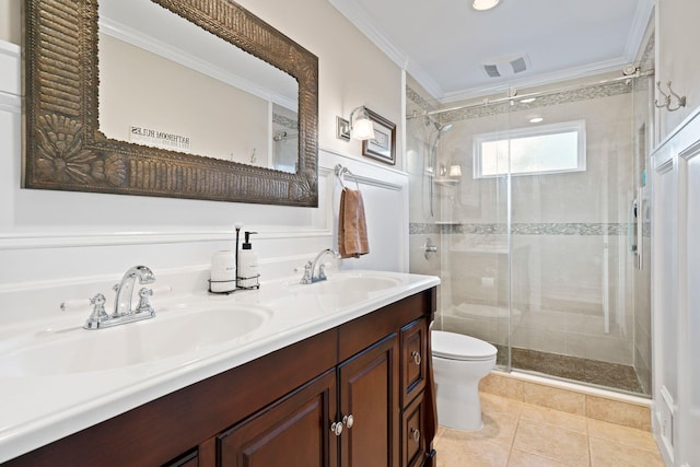 bathroom featuring toilet, ornamental molding, a sink, and visible vents