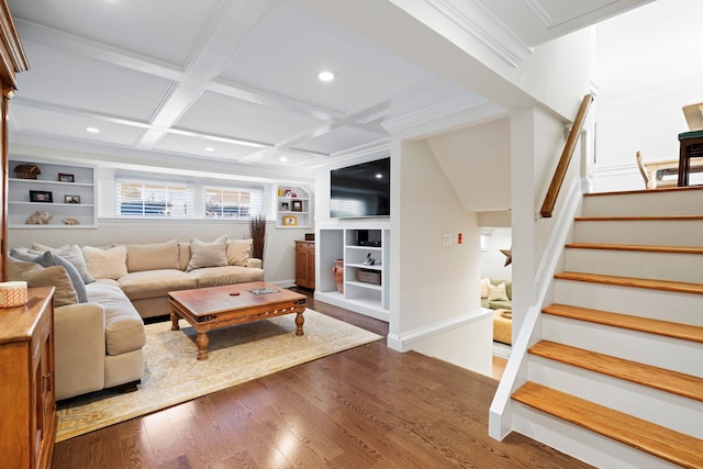 living area with baseboards, coffered ceiling, dark wood-style floors, stairway, and built in shelves