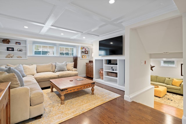 living room with built in shelves, recessed lighting, coffered ceiling, wood finished floors, and baseboards