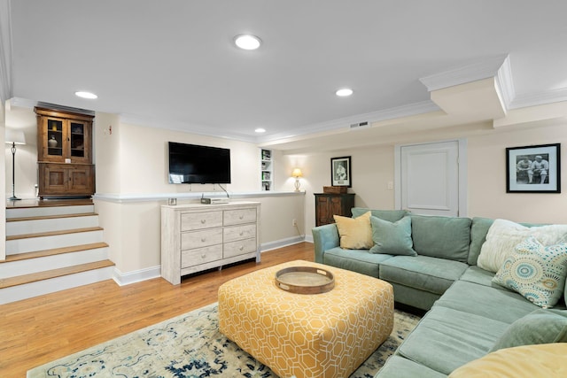 living area featuring light wood-style floors, stairway, ornamental molding, and recessed lighting