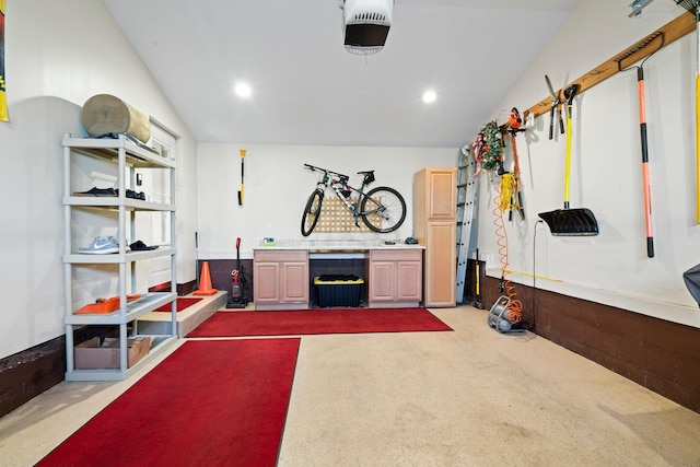 garage featuring recessed lighting and a garage door opener