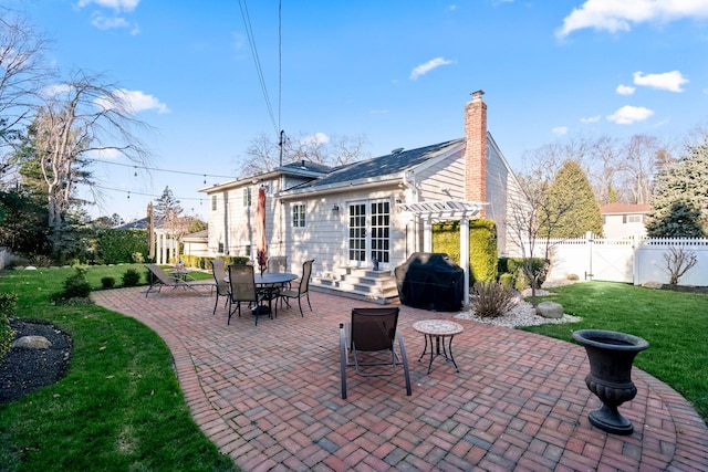 view of patio / terrace featuring fence, grilling area, and a pergola